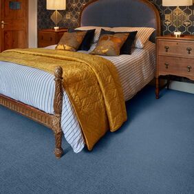 Polyflor Expona Fabrik in Dark Blue laid in a bedroom