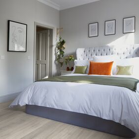 King size bed, pillow, lampshade, pictures, flowers, bedroom 