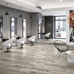Wood effect flooring laid in a modern style hairdressers
