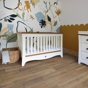 Babies room, Cot, Laundry basket, draws. animal wallpaper, oak flooring
