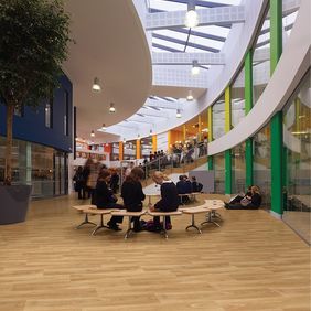 School break out area with seating and oak effect flooring