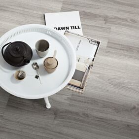 Side table, Coffee, cups, magazines, grey oak effect flooring 