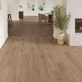 TLC Massimo in Warm Barnwood laid next to a fireplace with Warm Barnwood Large Parquet in the background.
