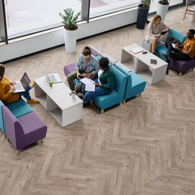 Oak effect flooring in parquet style laid in a commercial office space