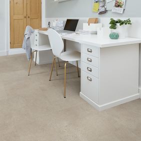 Light stone effect flooring in a home office 