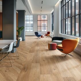 Oak effect flooring laid in office floor space