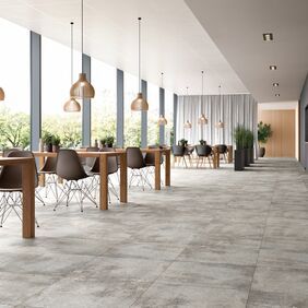 Light grey concrete effect flooring in a restaurant