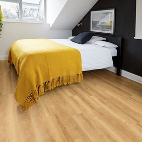 Light brown flooring in a bedroom with yellow accessories