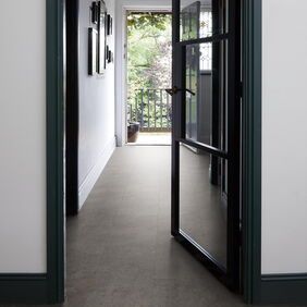 TLC Massimo in Caledonia Slate laid in a residential hallway