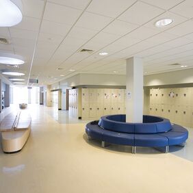 Higher education corridor with lickers and wood effect flooring