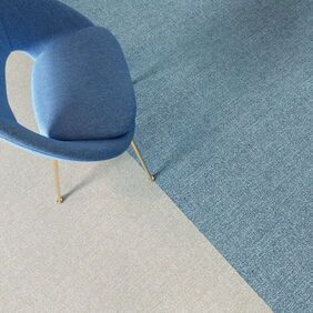 Polylfor Expona Fabrik in Light Blue and Light Beige with a chair