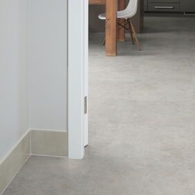 TLC Original in Chalked Concrete laid in a hallway and kitchen/dining room