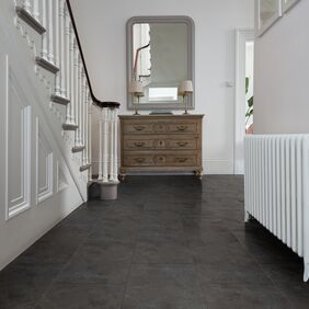 Hallway, staircase, radiator, table console, black slate flooring 