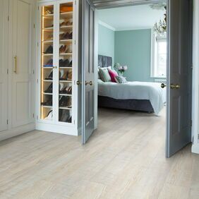TLC Massimo in New England laid in a walk in closet leading to a bedroom
