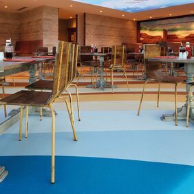 Restaurant with multiple shades of blue Polyflor flooring