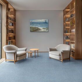 Polyfor Expona Fabrik in Light Blue laid in a library 