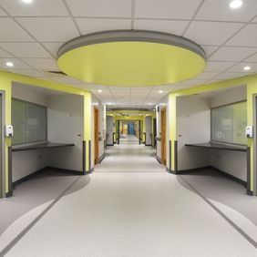 Grey and white flooring in a large hospital corridor