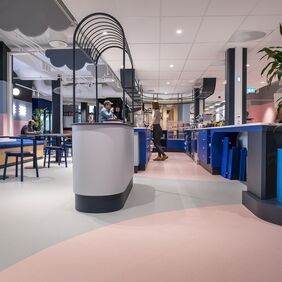 Chill out area with light grey and pink Polyflor flooring