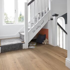 Oak effect flooring laid on a residential stair landing