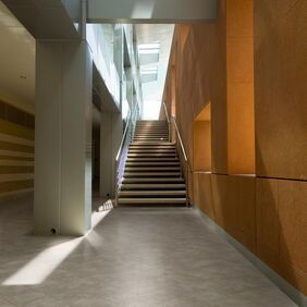 TLC Massimo in Smokes Sandstone in a hallway leading to a staircase