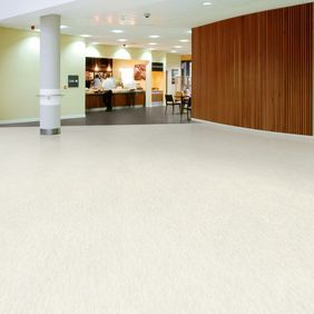 Light stone effect flooring in a canteen 