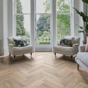 TLC Massimo in Blond Oak Large Parquet laid in a living room with cream furniture 