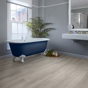 Dark blue bath with large modern sink and large mirror featuring the ligh oak wood effect flooring