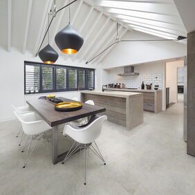 TLC Original in Chalked Concrete laid in a kitchen/dining room
