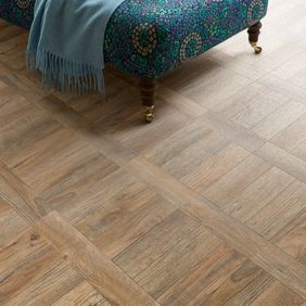 Close up of Chai Lounge featuring light brown wood effect flooring laid in Parquet Tramline design Cambridge Parquet