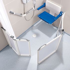Adapted shower area with light blue flloring