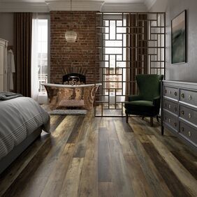 Rustic timber effect flooring laid in a bedroom