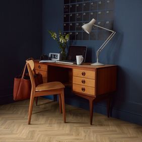 Home study with light wood effect flooring laid in a Herringbone pattern in third length planks