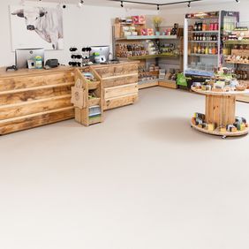 Neutral colour safety flooring in a farm shop