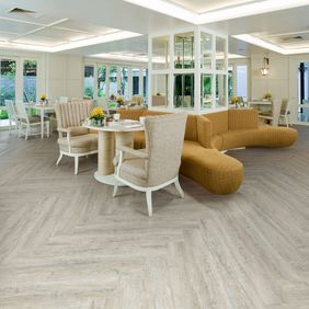 Dining area with full plank herringbone design rustic effect flooring