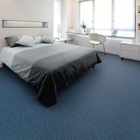 Polyflor Expona Fabrik in Dark Blue laid in a bedroom