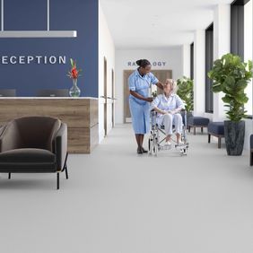 Light grey safety flooring in a hospital reception area 
