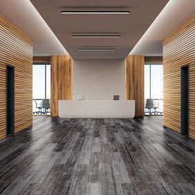 Large commercial office corridor with black abstract style flooring
