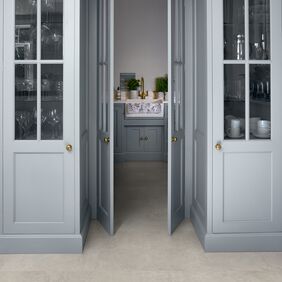 Glassware cupboards, cement style tile flooring 