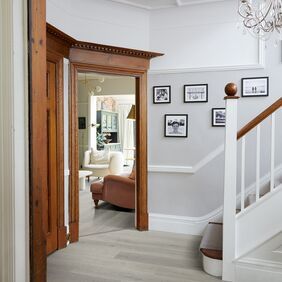 Light oak effect flooring in a residential entrance way