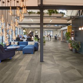 Oak effect flooring straight laid and prism style in a modern commercial office