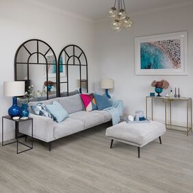 Grey sofa, foot rest, cushion, mirrors, comfy, light oak flooring 