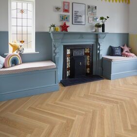 TLC Massimo in English Oak Large Parquet laid in a living room by a fireplace