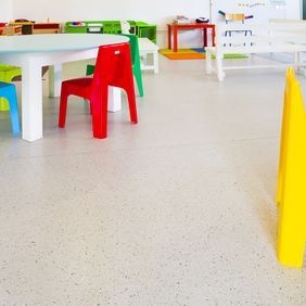 Primary school classroom with neutral coloured flooring