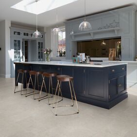 Kitchen island, stools, ceiling lights, flowers, vase, cement tile flooring 