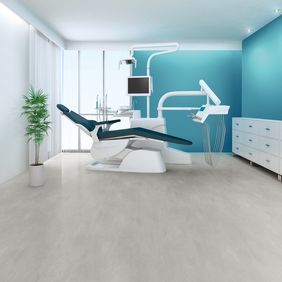 Light grey concrete effect flooring in a dentist examination room