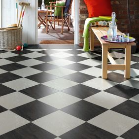 Dark slate and White slate tiles laid in a chess board style in a family home 