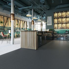 Modern resturant with dark flooring against light