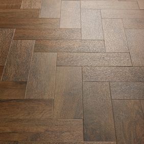 Close up of detail of the Georgian Parquet dark wood effect flooring 