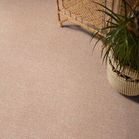 Polyflor Expona Fabrik in Dust Pink next to a potted plant 