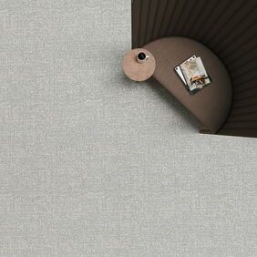 Polyflor Expona Fabrik in light grey with a brown chair and table 